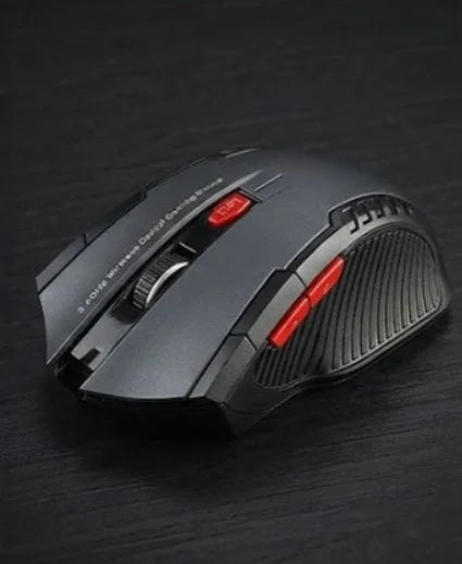 Black gaming mouse with red accents on a dark surface